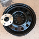 One of the new wheels with the spacer needed to make it work.Note the difference in size between the wider center hole of the spacer and the smaller hole in the wheel. This is why Markwardt had to machine out a bigger space for the hub.